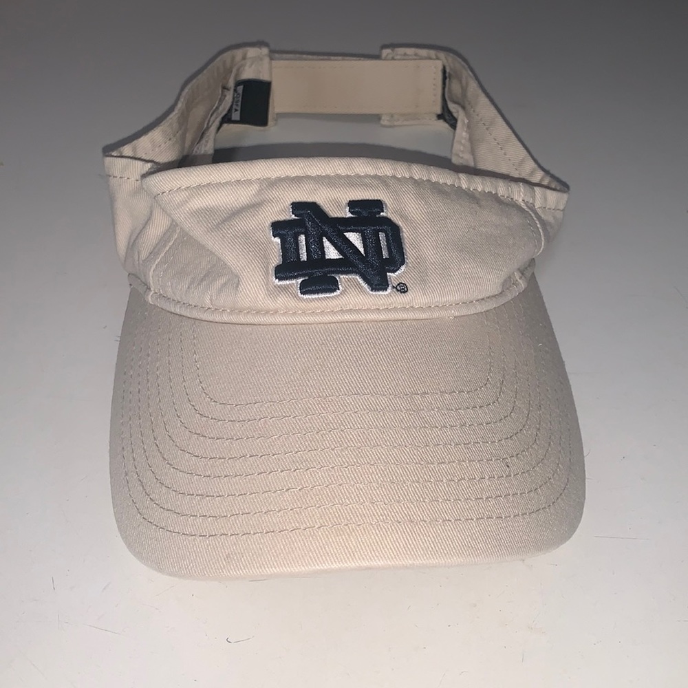 One size tan with navy logo Notre Dame visor.